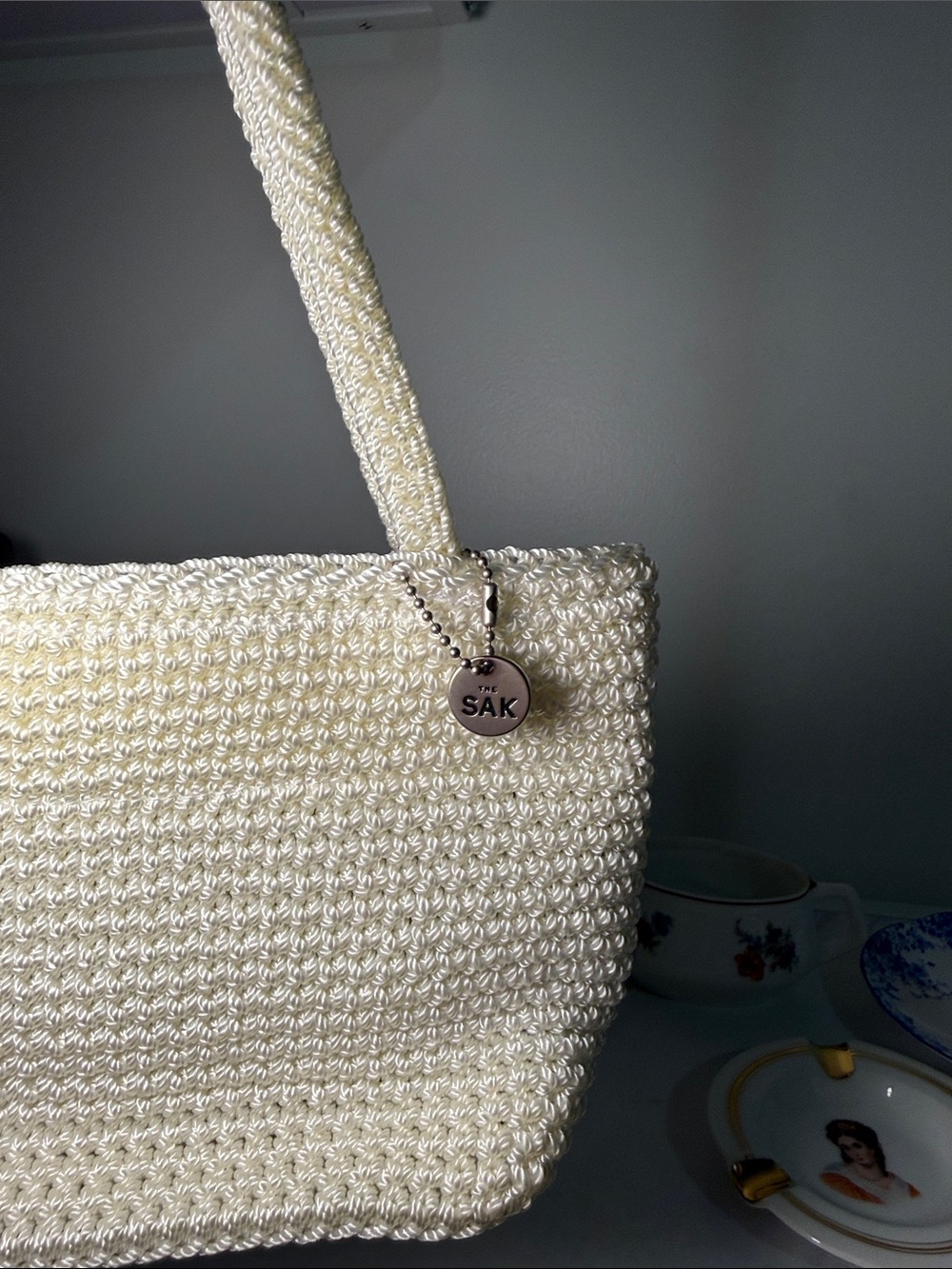 The Sak Cream Crochet Tote with Branded Charm